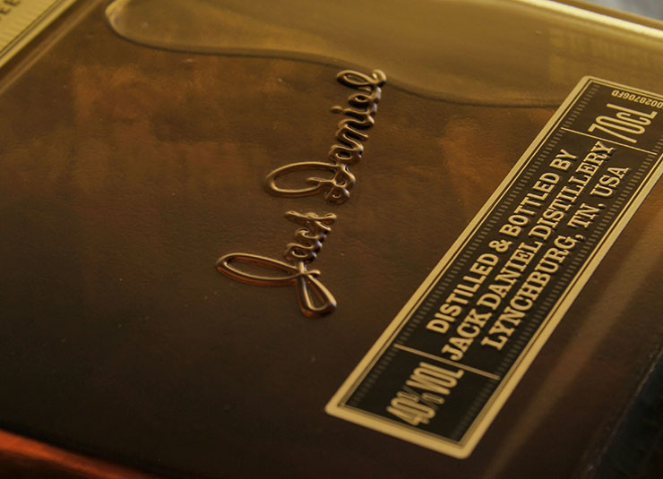 Close up detail of embossing on a luxury whisky bottle.